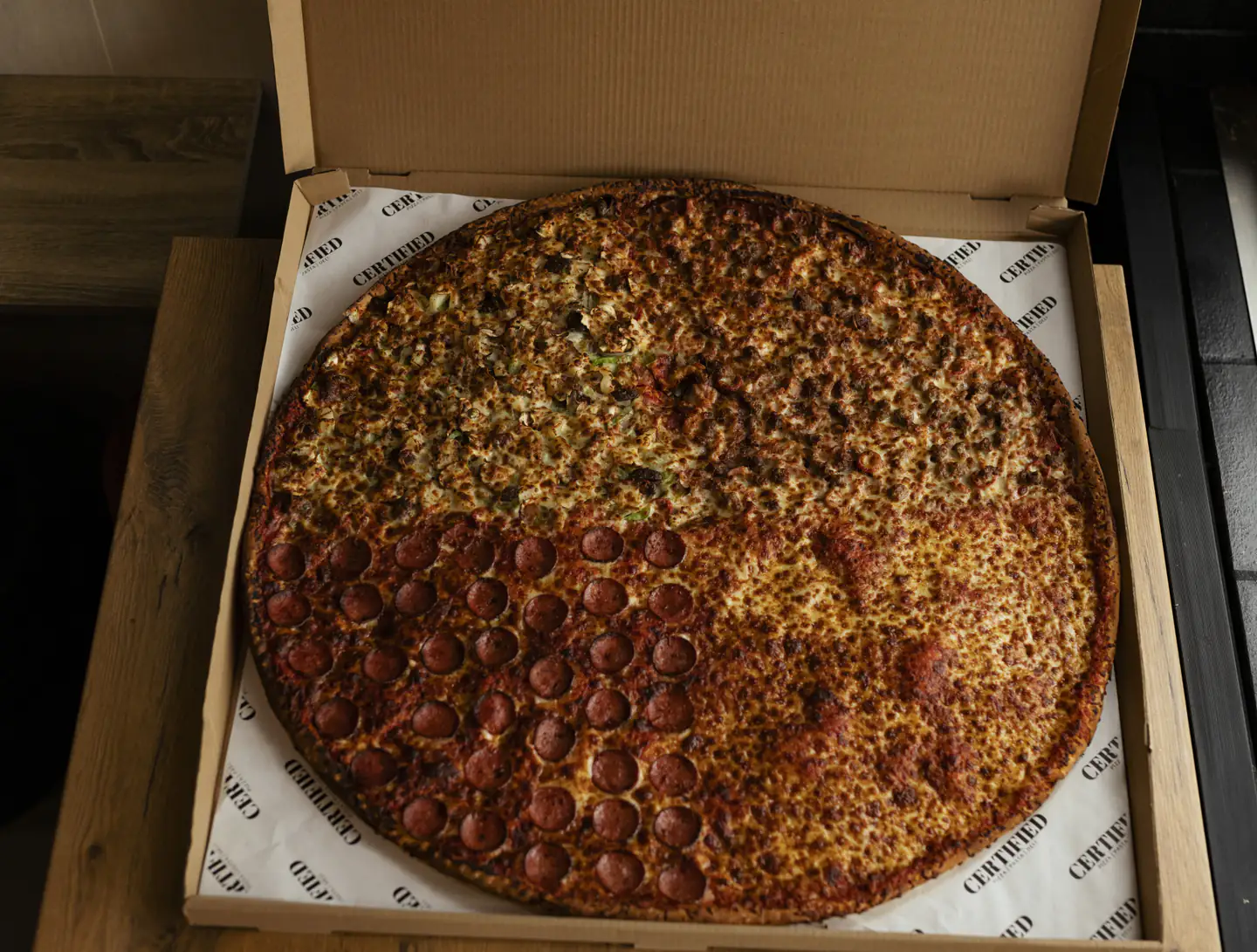 The famous 30 inch pizza St Marys — quartered giant pizza in a Certified Pizza box
